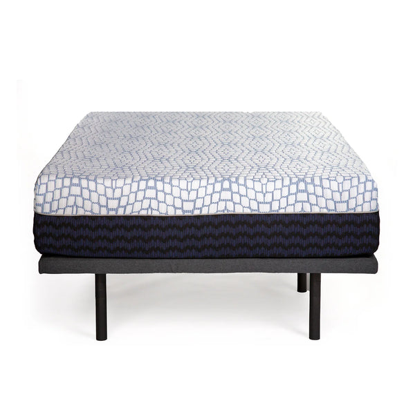 A front-facing view of the Bliss Hybrid mattress resting on a dark grey adjustable base. The white patterned top contrasts with the dark, textured side panels.