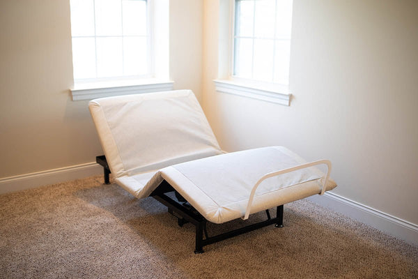 The affordable Flexabed Value-Flex adjustable bed base is shown with no full mattress. The head and foot sections are raised, highlighting the customizable movement of the frame.