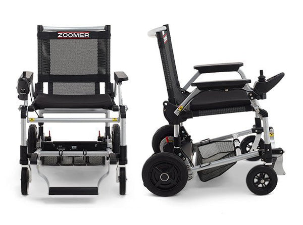 A two-panel product image showing the Zoomer from a direct front view (left) and a direct side profile (right). These views highlight the chair's slim profile, the rear anti-tipper wheels, and the low-profile motor housing between the rear wheels.