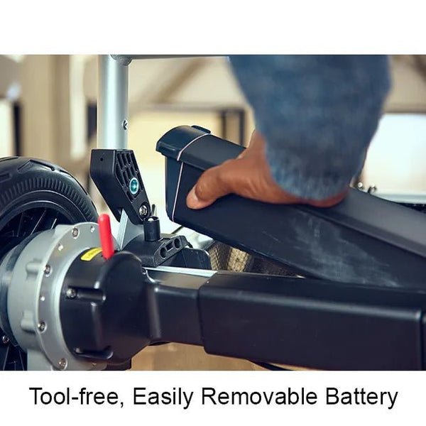 A close-up of a person sliding a long, black battery pack into the rear frame of the chair. Text at the bottom reads: "Tool-free, Easily Removable Battery."