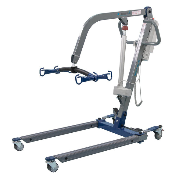 The Protekt 600 Bariatric Electric Patient Lift (Model 33600) features a metal frame, four wheels, and a spreader bar for sling attachment, supporting up to 600 lbs for safe transfers of individuals with limited mobility in hospital beds.