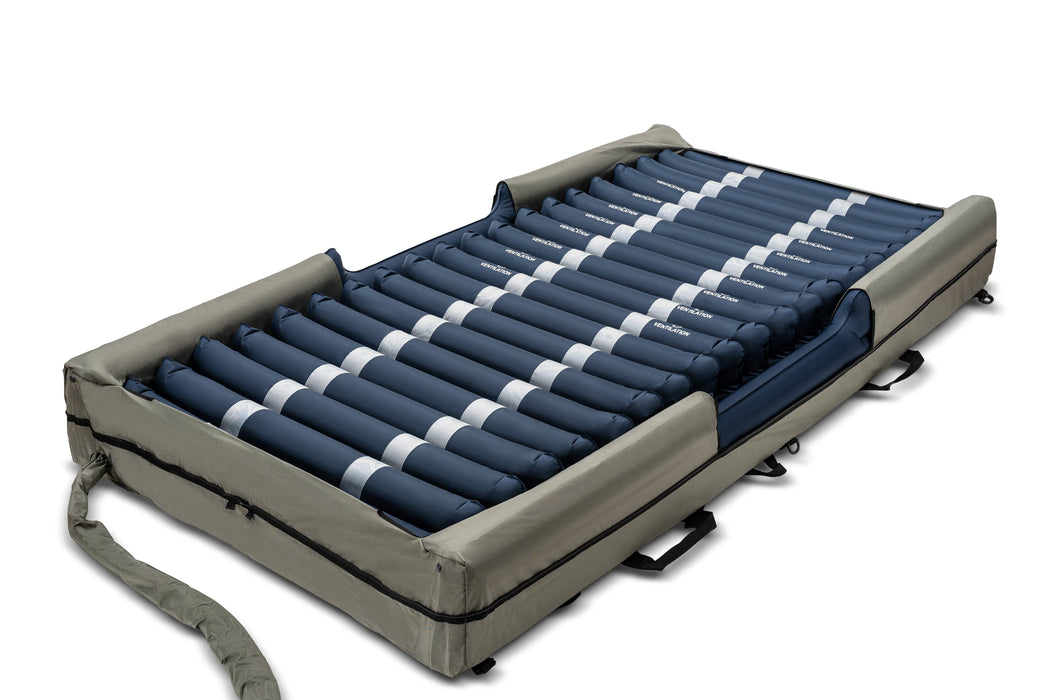 A large blue medical bed with a white stripe, known as the Emerald Bariatric Mattress with Digital Alternating Pressure LAL System, equipped with multiple tubes for added support and comfort. Ideal for bariatric care