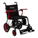 A studio portrait of the Journey Air Elite wheelchair with bold red accents on the armrests, wheel rims, and the stitching on the black mesh seat and backrest.