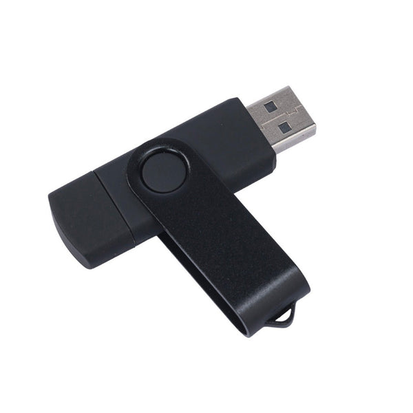 A black swivel-style USB flash drive, likely used for transferring patient data or scan results from the tablet.