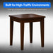 A square wooden table with four legs in a dark brown finish, shown against a gray gradient background with a blue text banner at the top that reads 'Built for High-Traffic Environments'.
