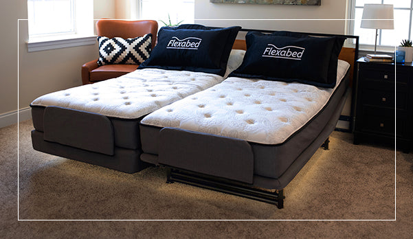 Dual Flexabed Hi-Low adjustable bed with optional mattress and underbed lighting, showing the Flexabed logo on two pillows