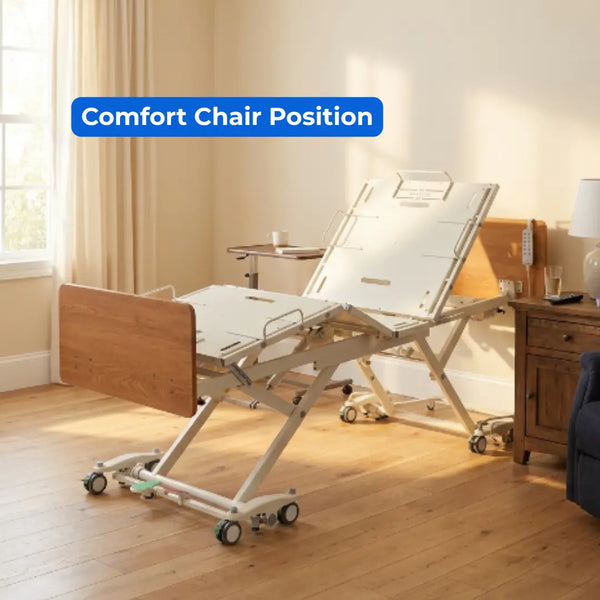 Emerald Infinity 54000 bariatric bed in comfort chair position with overbed table in home care room setting