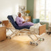 Senior woman reading in Emerald Infinity 54000 bariatric hospital bed with head and foot articulation and Proactive Medical mattress in assisted living room