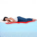 A woman rests on her side, a red glow highlighting pressure points—demonstrating how the Hospital Bed Mattress – IC20 ActiveX Temp-Responsive Foam offers pressure relief and comfort for sensitive areas.