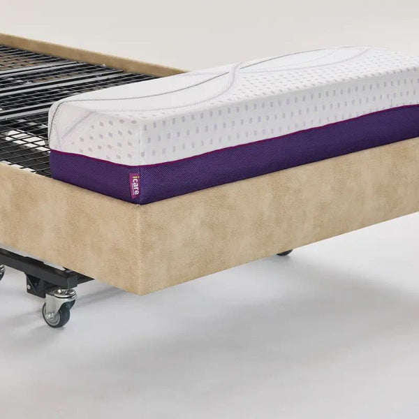 A close-up view of the bed frame at the foot end with the mattress removed. It shows how the mattress extension bolster sits securely on the metal slat base to extend the sleeping surface.