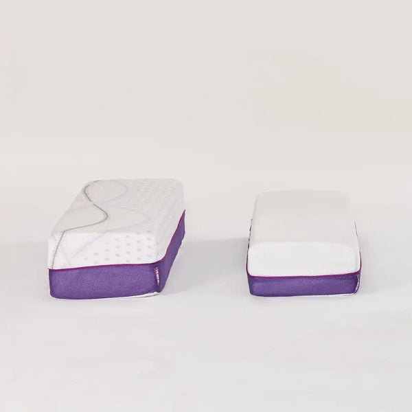 Detailed product shots of the standalone mattress extension bolsters. It shows two different sizes side-by-side, displaying the breathable purple mesh sides and the contour-matching top fabric.