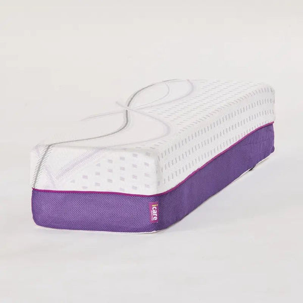 The standalone mattress extension bolster at an angle, displaying the breathable purple mesh sides and the contour-matching top fabric.