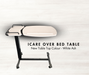 Promotional image for an Icare over bed table with a light-colored "White Ash" finish. The table is placed against a light wood-grain background. Text reads: "ICARE OVER BED TABLE. New Table Top Colour - White Ash."