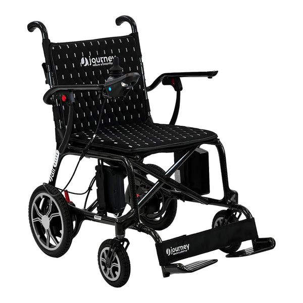 A studio portrait of the Journey Air Elite wheelchair with silver-white accents on the wheel rims and white stitching on the black mesh upholstery.