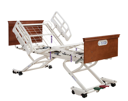 The EasyCare® Frame - Roll in Low Only is an adjustable long-term care bed on wheels, featuring a white metal frame, wooden head/footboard, raised side rails, and AdvanceCare positioning for customizable comfort in smart connected care environments.