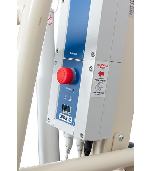 Close-up of the Free Spirit True Bariatric Patient Lift FS850 control panel featuring a large red emergency stop button, blue battery indicator, multiple connection cables below, and a LINAK label.
