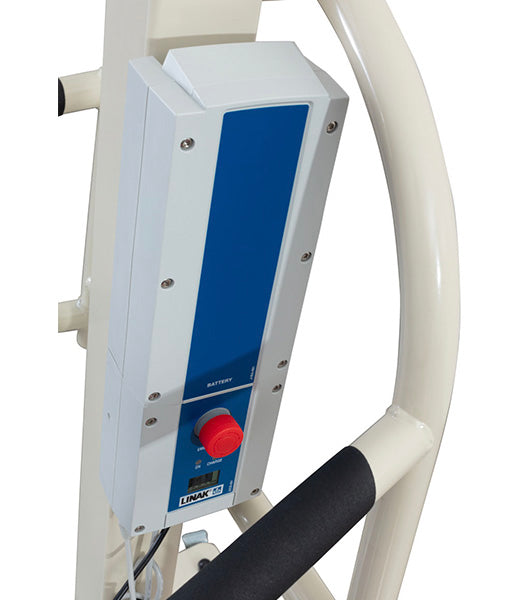Close-up of a control box with a blue panel and red emergency stop button attached to a white metal frame, designed for use with heavy duty lifts like the Free Spirit True Bariatric Patient Lift FS850.