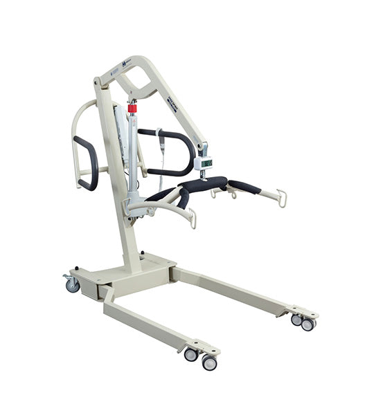 The Free Spirit True Bariatric Patient Lift FS850 is a beige heavy-duty lift with four wheels, arm supports, and a sling attachment, designed to assist in lifting and transferring individuals with mobility challenges.