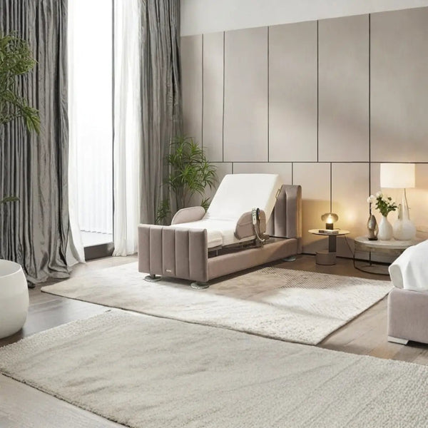 Orin rotating adjustable bed for seniors in a modern bedroom setting. The bed is shown in a front-facing position with the backrest elevated. It features a stylish design with mauve and grey upholstered vertical panels, side safety rails, and a sturdy base with circular chrome feet.