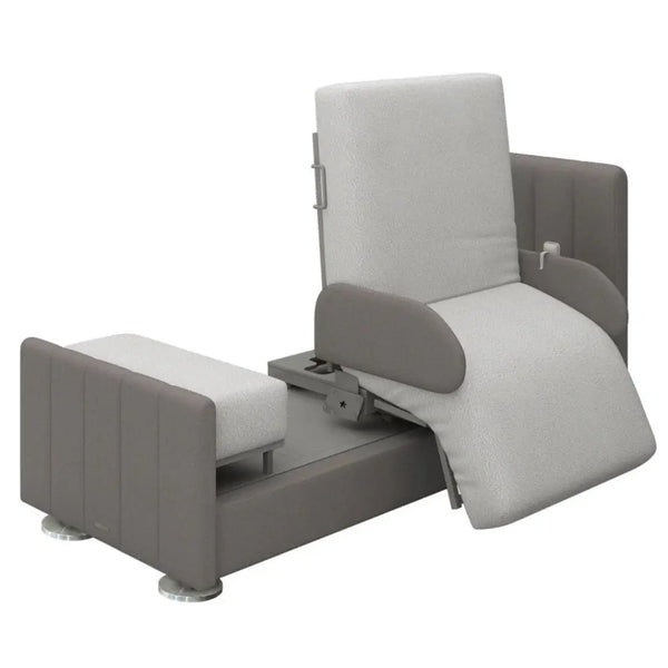 Orin rotating medical bed shown in the chair exit position. The mattress has rotated 90 degrees to the side and transitioned into a seated chair shape with the footrest lowered, showcasing the mechanism that assists users in getting in and out of bed.