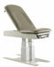 A Graham-Field Hausted 4600 Series powered exam table. This model features a heavy-duty dual-column lift base for adjustable height and an upholstered top with an adjustable backrest.