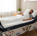Man resting comfortably on a Protekt 600 Bariatric Foam Mattress in a hospital bed