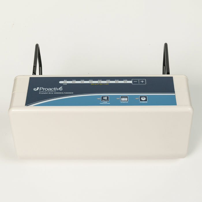 Protekt Aire 4000DX/5000DX system control unit with black mounting brackets attached, showing the complete control panel with weight setting scale, three control buttons, and mounting hardware for bed rail attachment