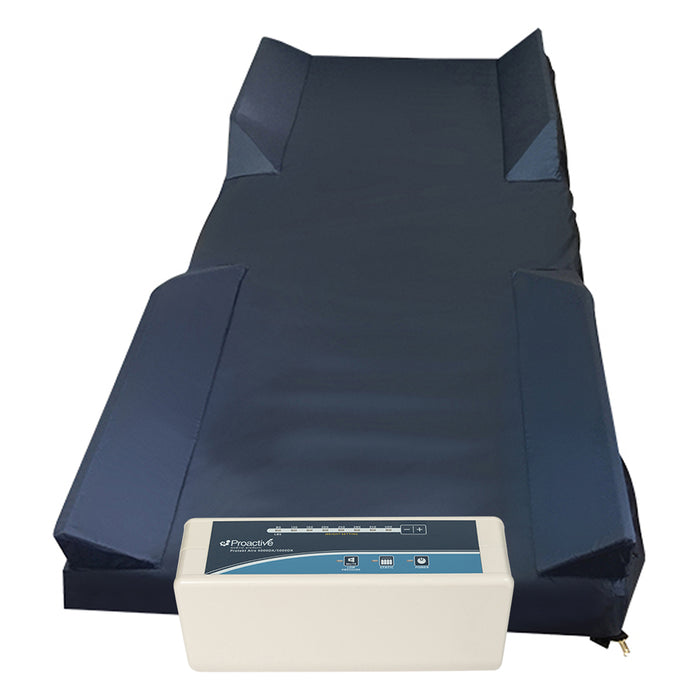 Protekt Aire 5000DX system complete setup showing foam raised rails and white control unit positioned at the foot of the mattress