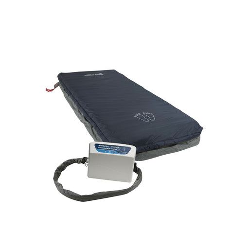 Protekt Aire 6000 system setup showing dark blue alternating pressure mattress connected to white control unit via air hose