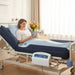 Protekt Aire 6500 system with foam raised rails in use showing patient resting comfortably on the dark blue alternating pressure mattress in a hospital bed setting with the control unit mounted on the bed frame