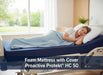 A woman sleeps on her side in a hospital bed, covered by a light blue blanket. She is lying on the dark blue Proactive Protekt HC 50 foam mattress with cover. Overlay text reads: "Foam Mattress with Cover Proactive Protekt® HC 50"