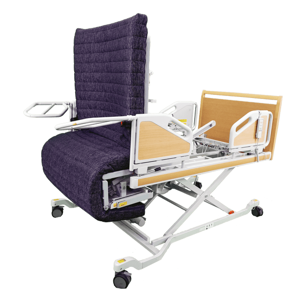 The ReNuCare Standing Bed is a 4-position adjustable hospital bed with a purple padded recliner, white metal frame, armrests, wooden head/foot panels, and wheels for easy mobility—ideal for patient care.