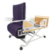 The ReNuCare Standing Bed is a 4-position adjustable hospital bed with a purple padded recliner, white metal frame, armrests, wooden head/foot panels, and wheels for easy mobility—ideal for patient care.