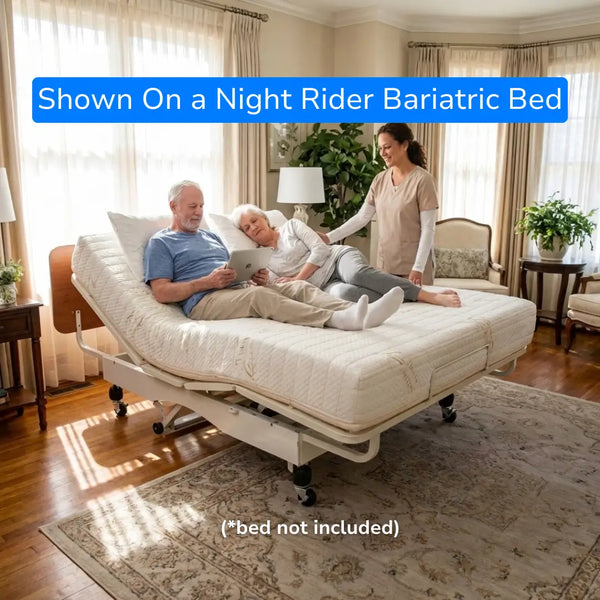 Senior couple relaxing on a Transfer Master Ascent hospital bed mattress with bamboo cover, shown on a Supernal 3 adjustable bed frame in a bright home setting.