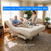Senior couple relaxing on a Transfer Master Ascent hospital bed mattress with bamboo cover, shown on a Supernal 3 adjustable bed frame in a bright home setting.