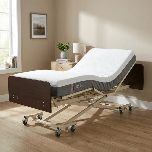 Adjustable bed with a gray IC30 mattress in a room setting, featuring a wooden headboard and footboard, along with a beige and peaceful interior design. The bed is in an elevated position to show its adjustable features.