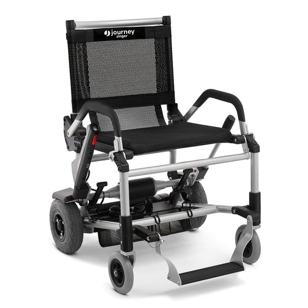 A high-resolution studio shot of the Journey Zinger power chair in black with a silver frame.