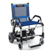 A high-resolution studio shot of the Journey Zinger power chair in blue with a silver frame.