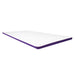 A clean, isolated, angled shot of the white ActiveX mattress overlay, highlighting its smooth surface and purple edge trim against a plain white background.