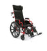 Three-quarter front view of the red Ziggo Pro pediatric reclining wheelchair featuring a high-back design and elevating leg rests.