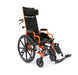 Three-quarter front view of the orange Ziggo Pro pediatric reclining wheelchair with a black padded headrest and black upholstery.