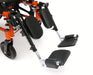 Detail of the elevating leg rests on a Ziggo Pro wheelchair, featuring padded calf supports and adjustable footplates.