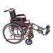 A side profile of the red Ziggo wheelchair with the leg rests fully extended and elevated. The leg rests include padded calf supports for increased comfort.