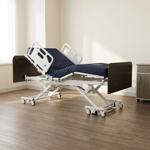 Adjustable hospital bed in cardiac comfort chair position with dark mattress, white side rails, wood panel headboard and footboard, and caster wheels in room setting.