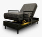 The UPbed Independence Adjustable Bed for Seniors by Journey Health features a patterned dark cushion, armrests, corded remote control, raised headrest, black frame, and under-bed lighting for convenience and fall prevention.