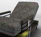 The UPbed Independence Adjustable Bed for Seniors by Journey Health features a black and gray wavy cover, raised backrest, black armrests, remote control on the side, and sits elevated on a platform base for improved fall prevention.