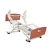 Joerns UltraCare XT hospital bed frame shown in a fully articulated position (head and knees raised) with decorative head and foot boards in a spiced cherry finish.