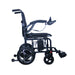 A side profile of the Journey Air 2026 power chair against a white background. The image highlights the ergonomic curved armrests, the rear anti-tipper wheels for safety, and the red suspension springs on the front casters.
