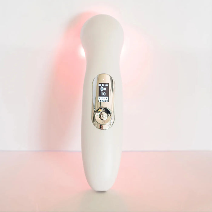 White Oceanus Lasonic ultrasound and laser therapy device showing digital display screen and control button on handheld unit