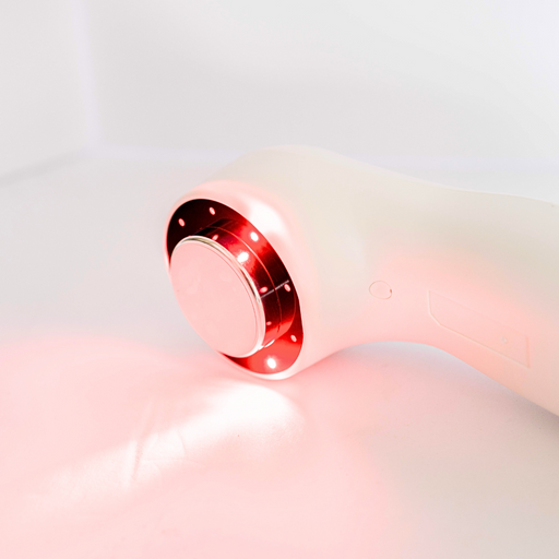 Angled view of Oceanus Lasonic therapy device treatment head displaying infrared/laser light therapy array around circular ultrasound head